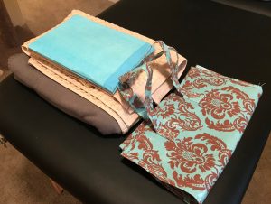 fleece blanket, towels, and a storage bag